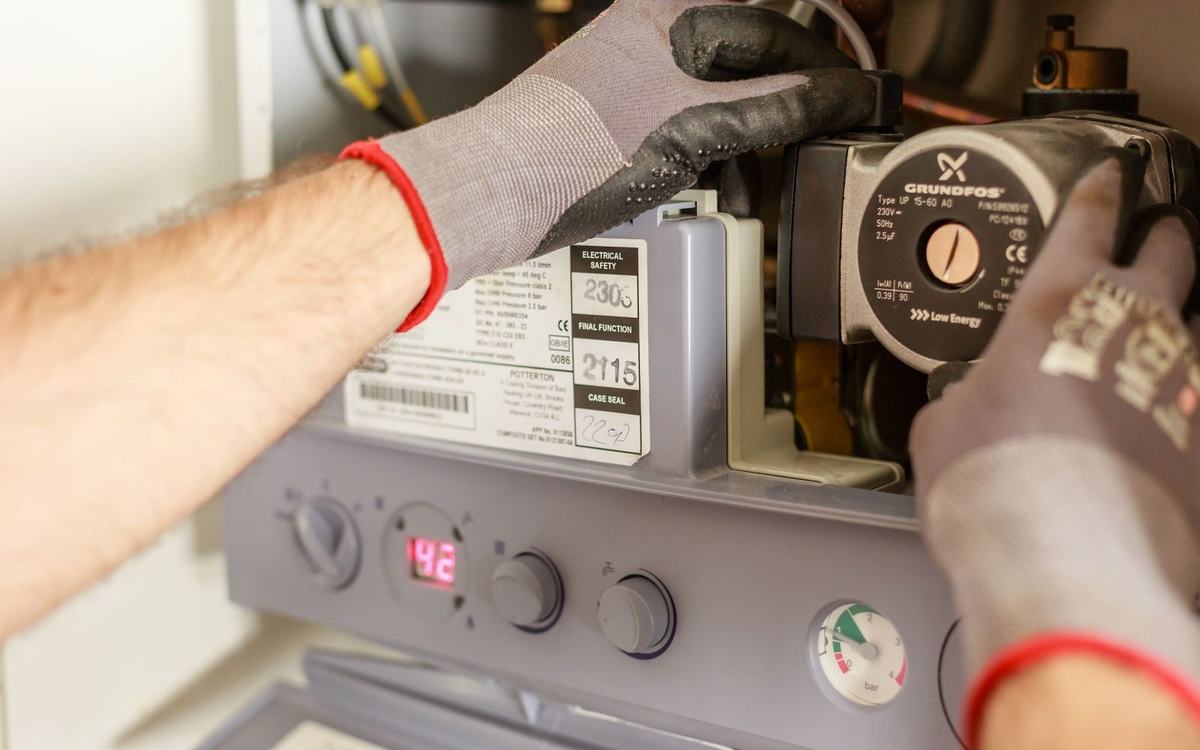 Plumber working on a domestic gas boiler